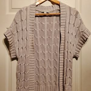 Small, beige short sleeve sweater